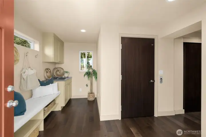 Mud room entry and elevator door. All interior doors have been updated to solid sapele wood doors