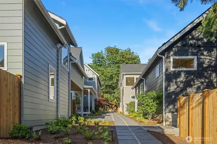 The 40th Ave Collection. Wide pedestrian path, lush plantings and a built in community.