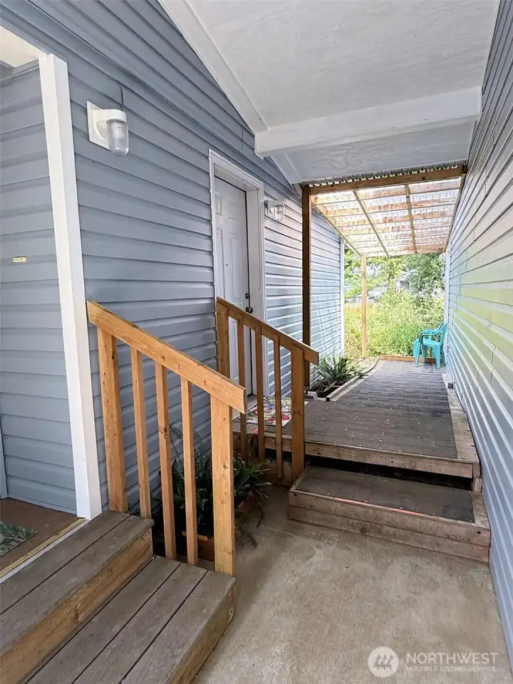 Covered walkway with ramp to the garage!