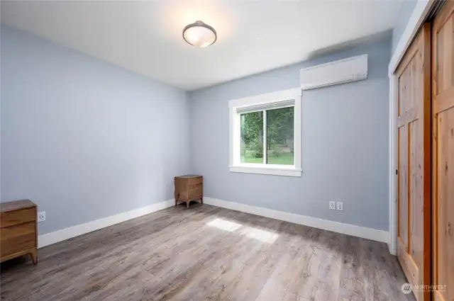 Bedroom with electric mini split for heat, nice sized window and full closet with built in closet organizer.