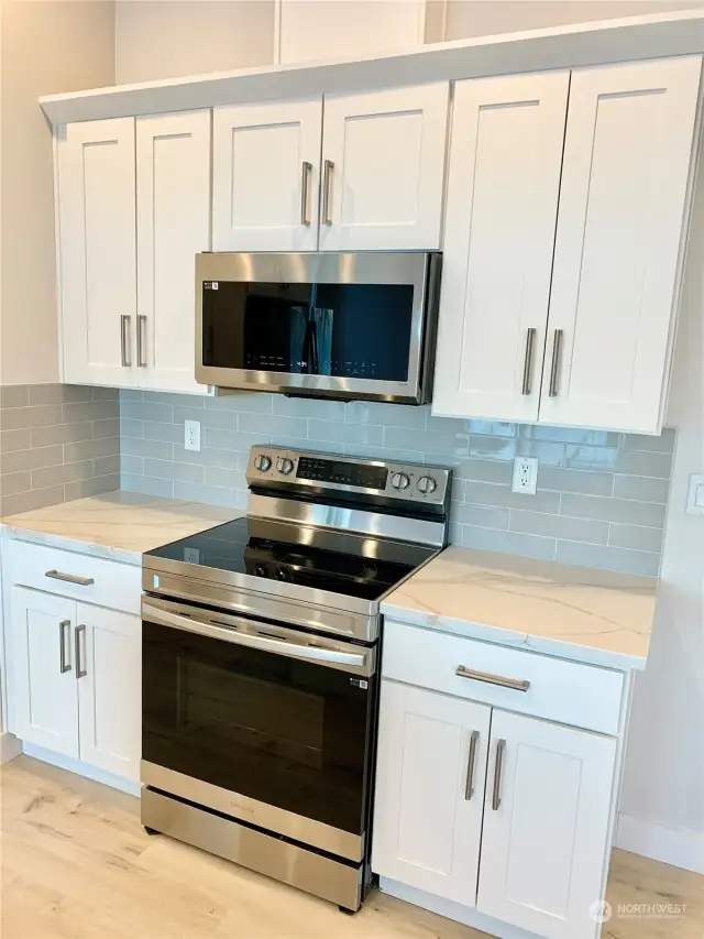 White cabinets, stainless appliances