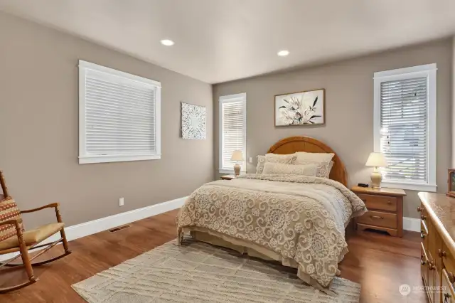 Main Floor primary bedroom with attached bath en-suite and walk-in-closet.