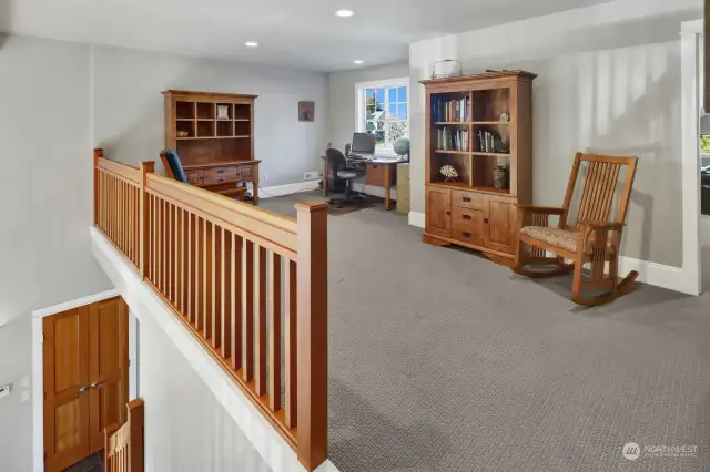 Upstairs features a flex space/loft, bonus room, two bedrooms, and a full-size bathroom.