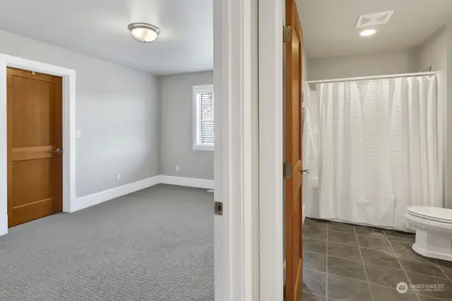 One of two upstairs bedrooms, this one has a walk-in-closet and also opens to the bathroom.