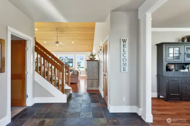 Step inside and have a look. Dining room on the right, half bath on the immediate left with the laundry room and access to the garage just before the stairwell.