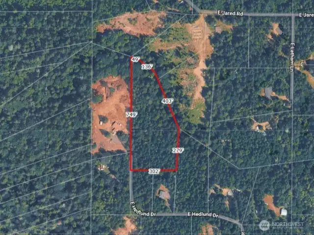 Overhead view with approximate boundaries in red and dimensions from county records.