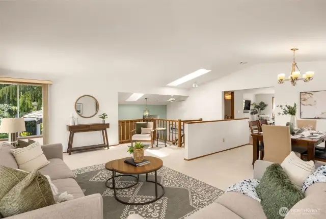 Walls of windows showcase this incredible bright Living and dining room perfect for entertaining!