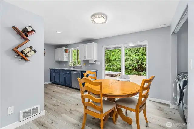 Cute dining room with slider to back porch