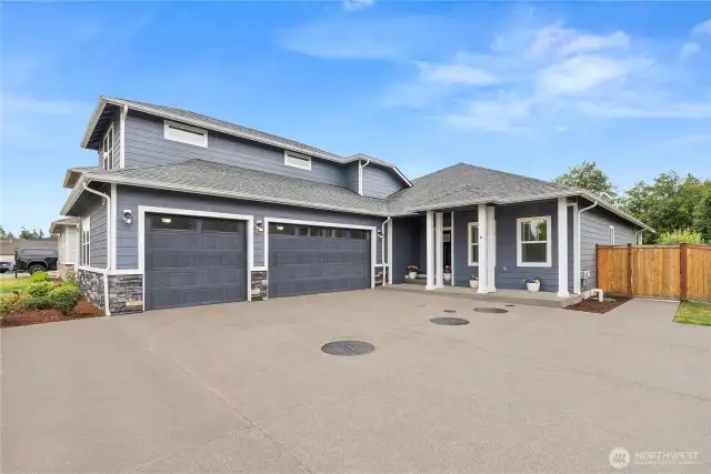 Immaculate modern home with 3-car garage and RV parking, elegant stone accents, and welcoming covered entry - blending style, function, and curb appeal in one perfect package.