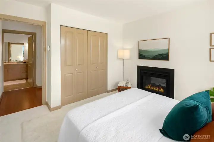 King sized bedroom captures Western views and the double sided gas fireplace, all new interior paint.
