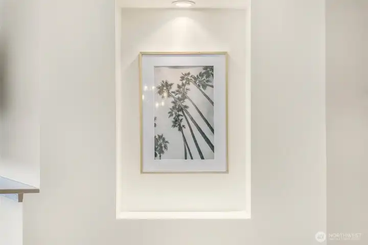Thoughtful architectural details,  with lighted hallway with two display niches for showcasing art or favorite decor items.