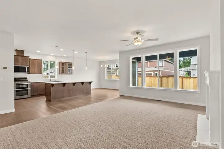 Open entertaining area between the living room and kitchen features large, oversized windows for perfect, natural light.
