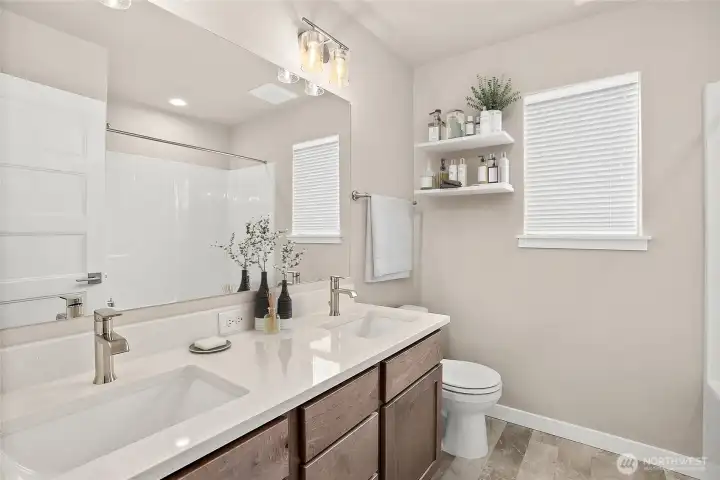 Virtually staged upstairs hall bath for illustration only.