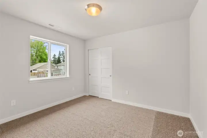 Third bedroom features plush carpet and great natural light