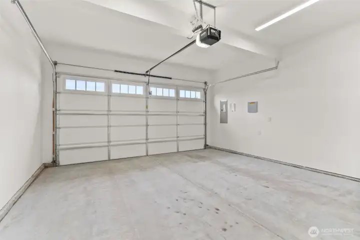 Two-car garage is primed for a more finished look and does come with garage door opener.