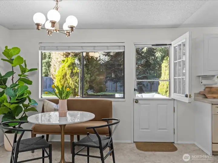 Dining room is highlighted by the white 9-lite Dutch door. This classic Dutch door adds timeless character and abundant natural light.