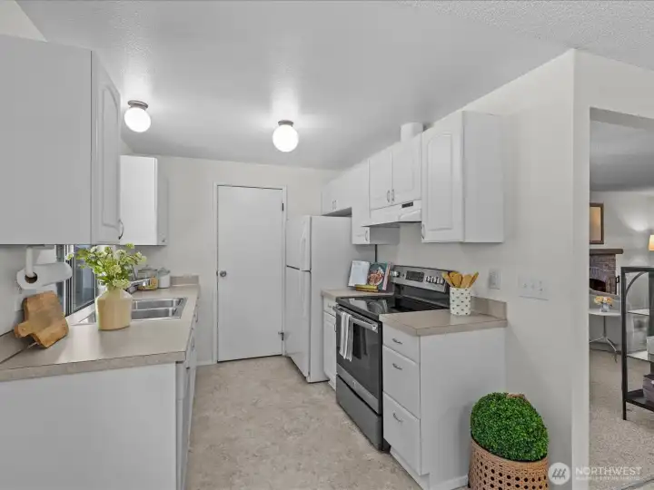 Galley kitchen with beaming natural light