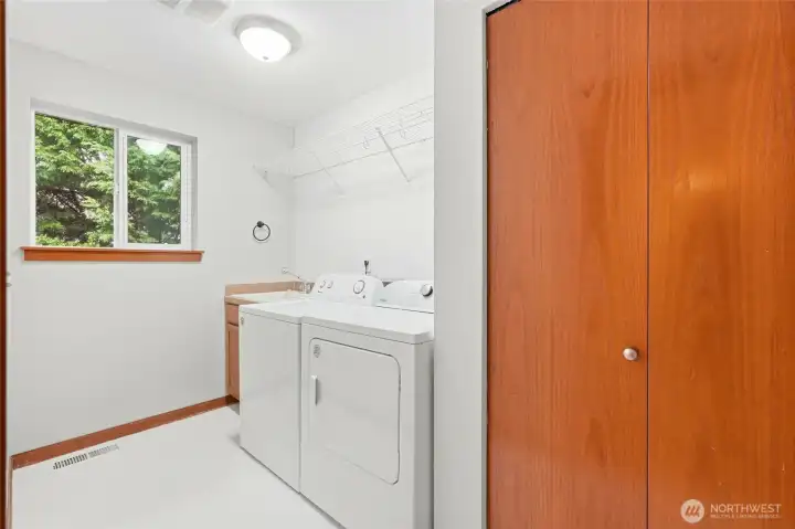 MAIN LEVEL LAUNDRY ROOM WITH WASHER DRYER