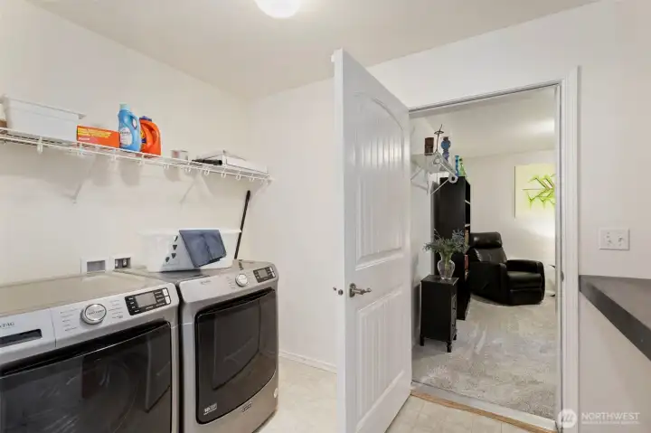 Laundry room with access to bonus room