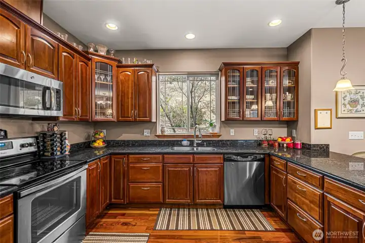 Lots of cabinets and granite countertops