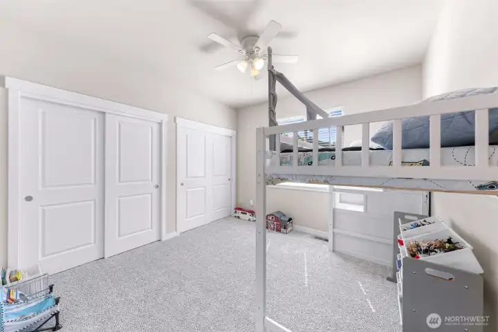 Large second bedroom on main level filled with natural light and large double closets