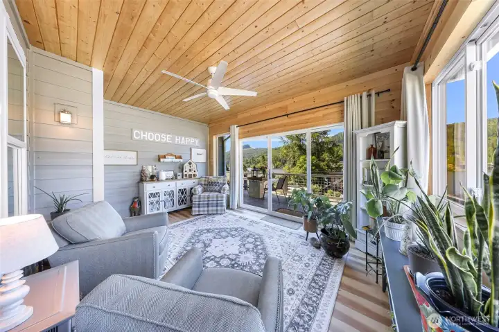Converted outdoor space into indoor space created a beautiful sunroom located just off the main level living space, with gorgeous lake views to enjoy all year around.
