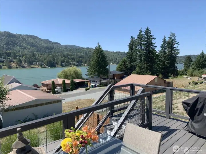 Lake views from the deck and stairway leads down to lower level deck and hot tub area with access to basement ADU