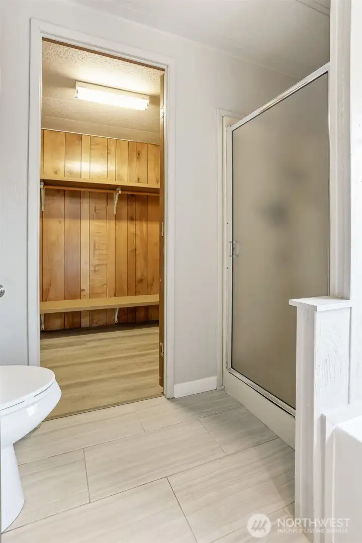 Master bedroom suite with vaulted ceilings, walk in closet and updated 4 piece bathroom