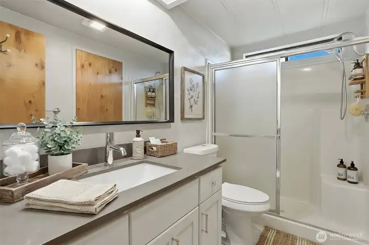 Updated hall bathroom - virtually staged photo