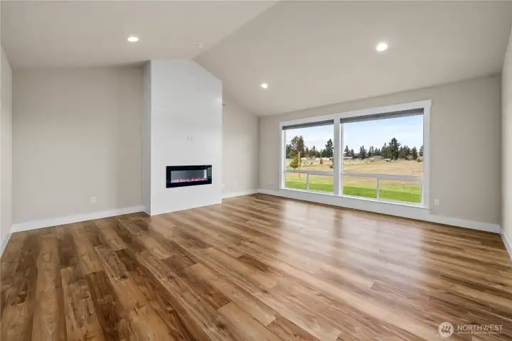 Gorgeous Floors and Natural Light Fill this Living Rm
