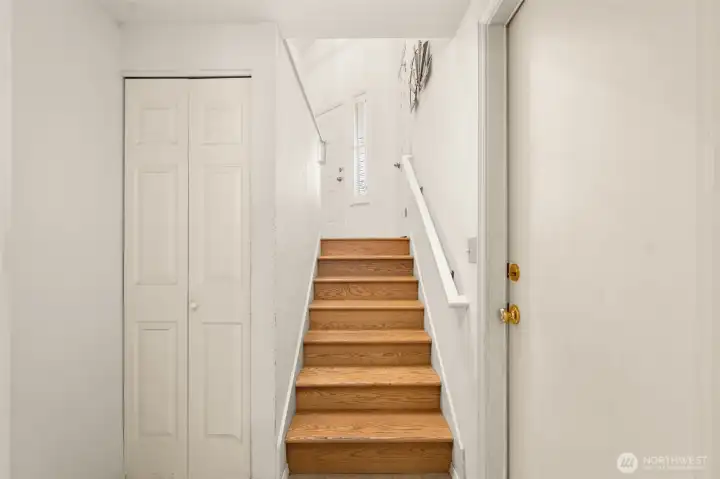 Downstairs houses Laundry Room and  interior garage access.