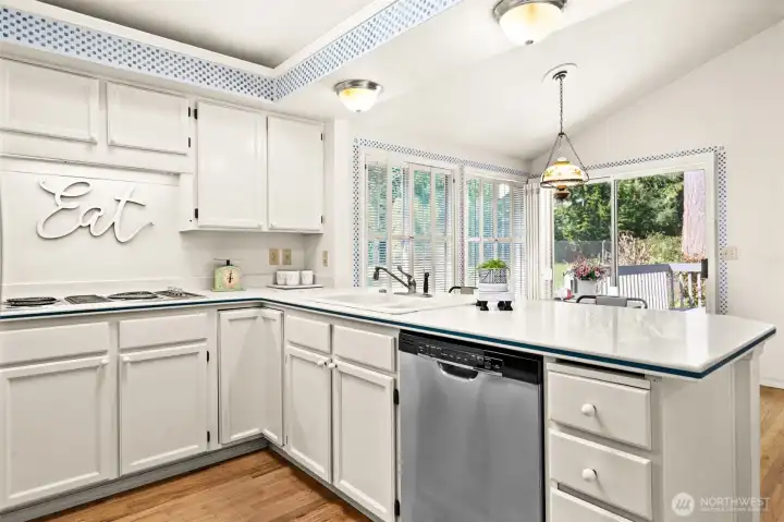 Large kitchen overlooks nook and family room. SS Appliances.