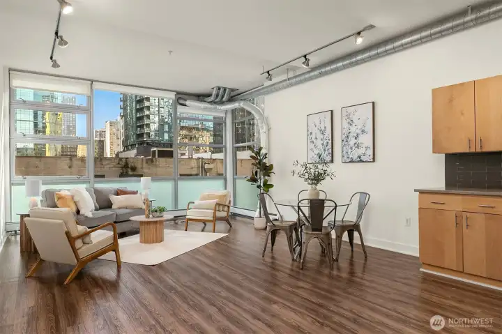 Open floor with towering 13 foot ceilings and west-facing floor-to-ceiling windows the bring in lots of great natural light while keeping the space private and functional