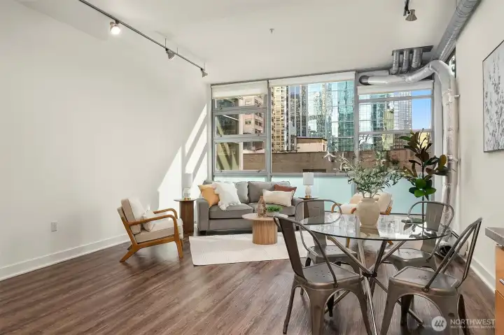 Open floor with towering 13 foot ceilings and west-facing floor-to-ceiling windows the bring in lots of great natural light while keeping the space private and functional
