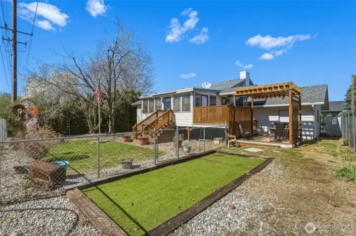 Fenced backyard with dog run