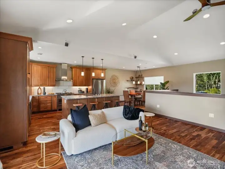 The heart of the home features an open-concept design where the kitchen, dining, and living areas come together in one welcoming, connected space—perfect for gathering and making memories.