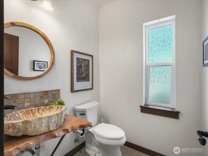 Guest half bath on main level is a very unique Petrified Maple sink.