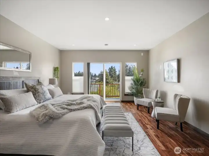 The primary bedroom offers ample room to comfortably accommodate a king-size bed along with additional furnishings. Thoughtfully designed, it provides a serene and inviting retreat with both comfort and versatility in mind.