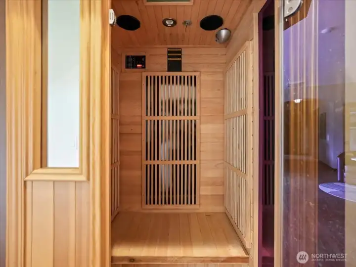 Unwind in your private lower-level retreat, featuring a built-in sauna designed for ultimate relaxation and wellness. Just steps away, the hot tub offers a tranquil escape, creating a spa-like experience in the comfort of your own home.
