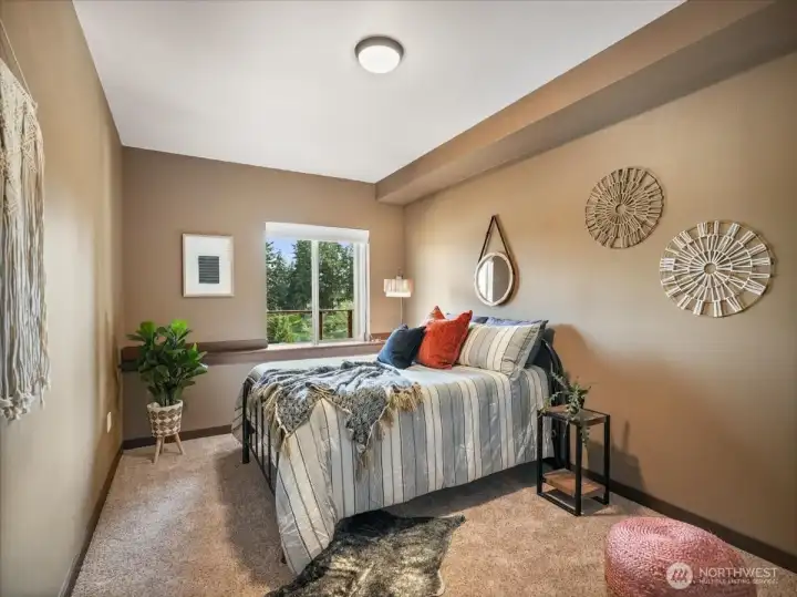 One of the downstairs rooms is generously sized and offers the flexibility to serve as a fourth bedroom or a versatile flex space. Ideal for a home office, media room, or guest suite, it adapts effortlessly to your lifestyle needs.