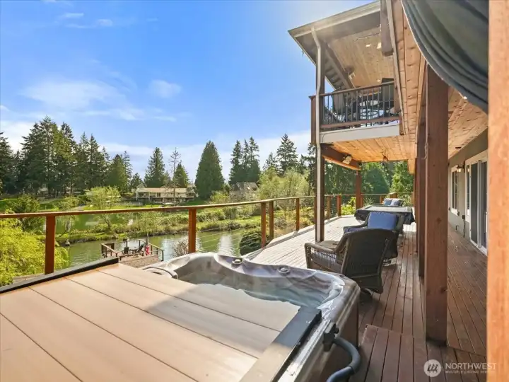 Just steps away, the hot tub offers a tranquil escape, creating a spa-like experience in the comfort of your own home.