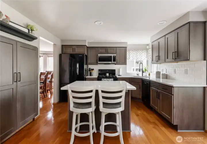 Abundant cabinetry plus a pantry with pull-out drawers for added functionality
