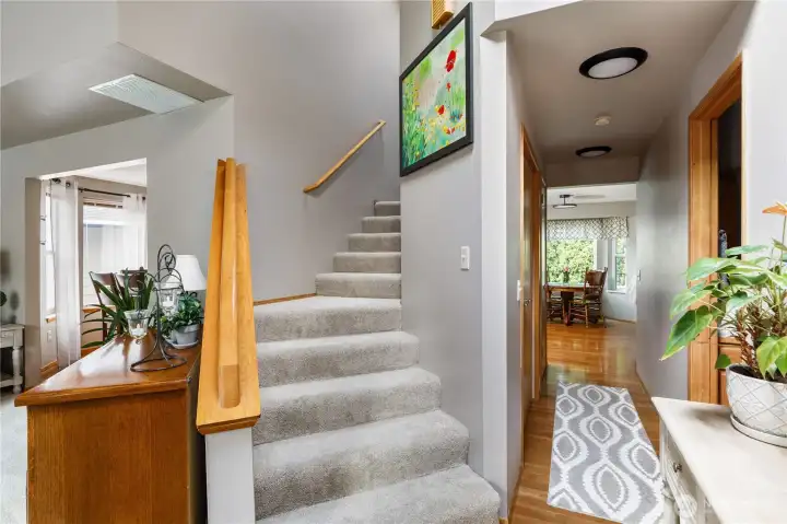 Upstairs you'll find the primary bedroom plus two additional bedrooms and a full bath upstairs