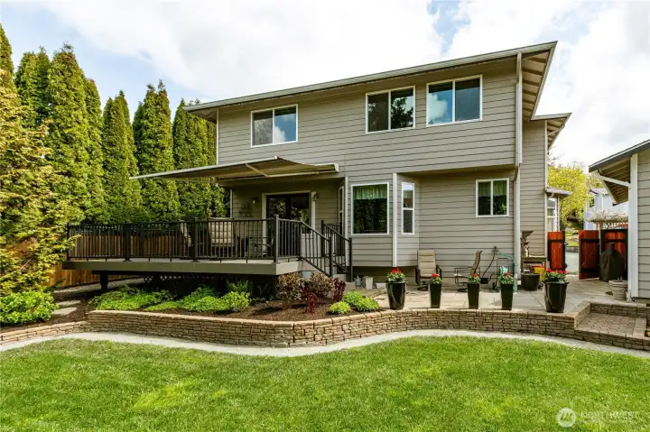Beautifully landscaped backyard with lush perennial garden