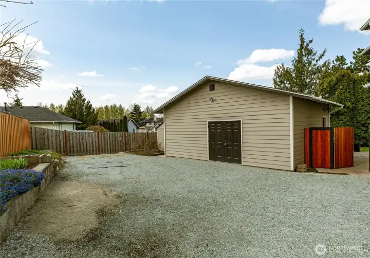 Spacious detached shop offering incredible versatility. Ample parking for toys, hobbies, or additional vehicles.