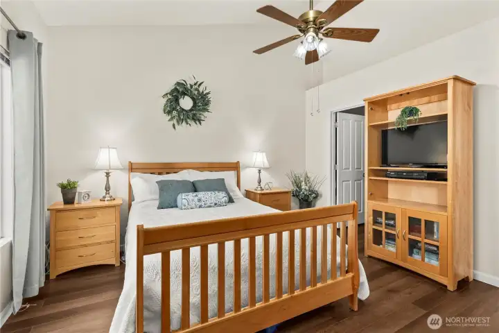 Main floor primary bedroom with soaring ceilings/walk-in closet & private bath