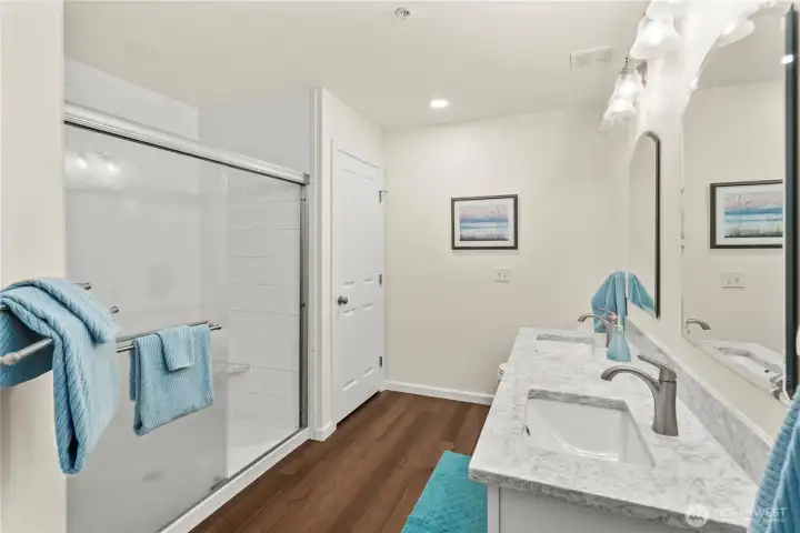 Remodeled 3/4 primary bathroom with quartz countertops