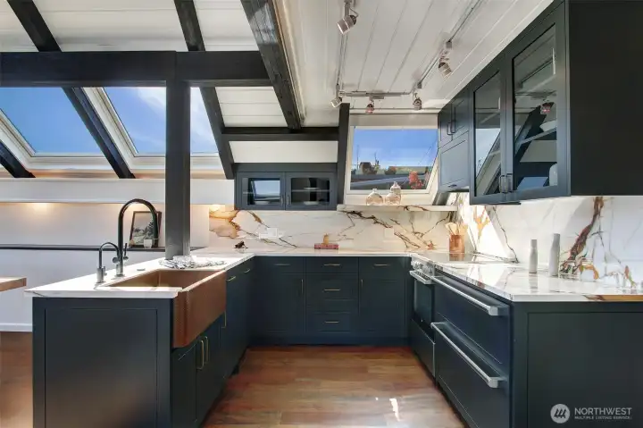 The kitchen was remodeled in 2024 adding extra counter length, custom cabinets, appliances, hardware, counter tops and a copper sink.