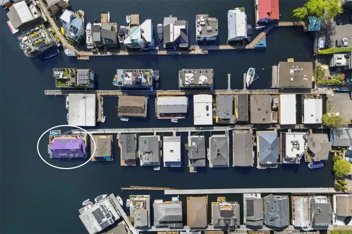 From a birds-eye view, the boat moorage is located along the channel side.  Following the channel side, the condo dock also owns the second dock for guests to temporary tie up their boats while visiting.