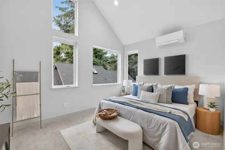 Vaulted ceilings with south facing windows in this primary suite